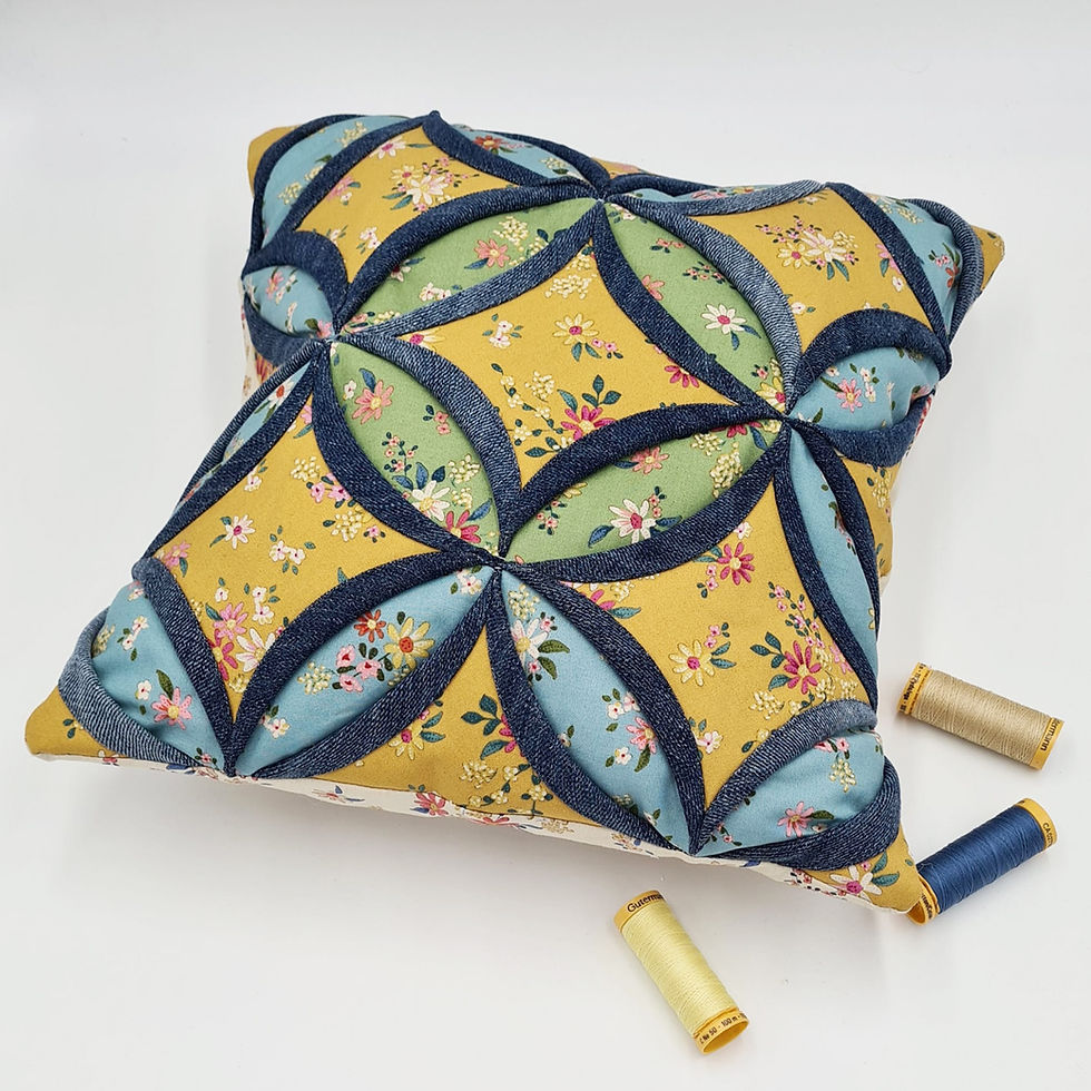 Thumbnail: Detail pic promoting the Cathedral Windows Block Cushion Cover video workshop by craft expert Sarah Payne