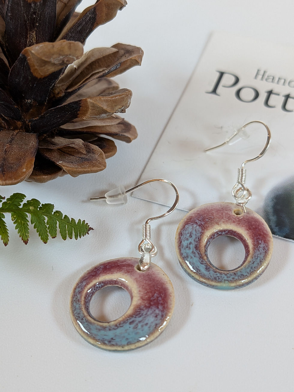 Thumbnail: handmade doughnut shaped ceramic and sterling silver earrings in pink and turquoise