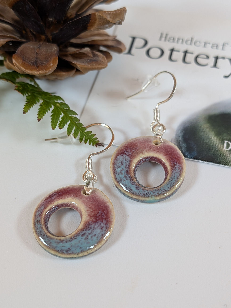 handmade doughnut shaped ceramic and sterling silver earrings in pink and turquoise