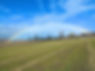 Rainbow over freshly mowed Field 
