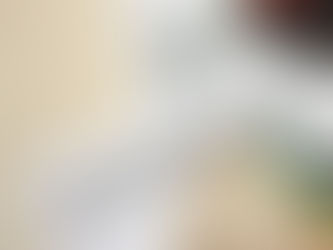 Tax documents labeled T1 General 2024, Canadian bills, a pen, and a calculator on a wooden surface, indicating finance tasks.