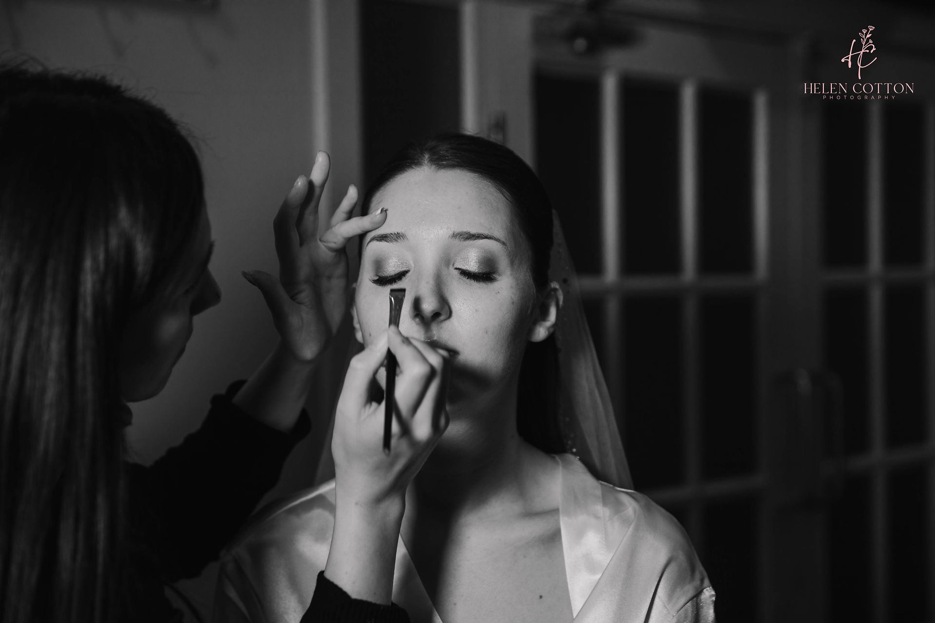 bride getting her wedding make up