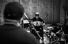 Black and white picture of a man being recorded.jpg
