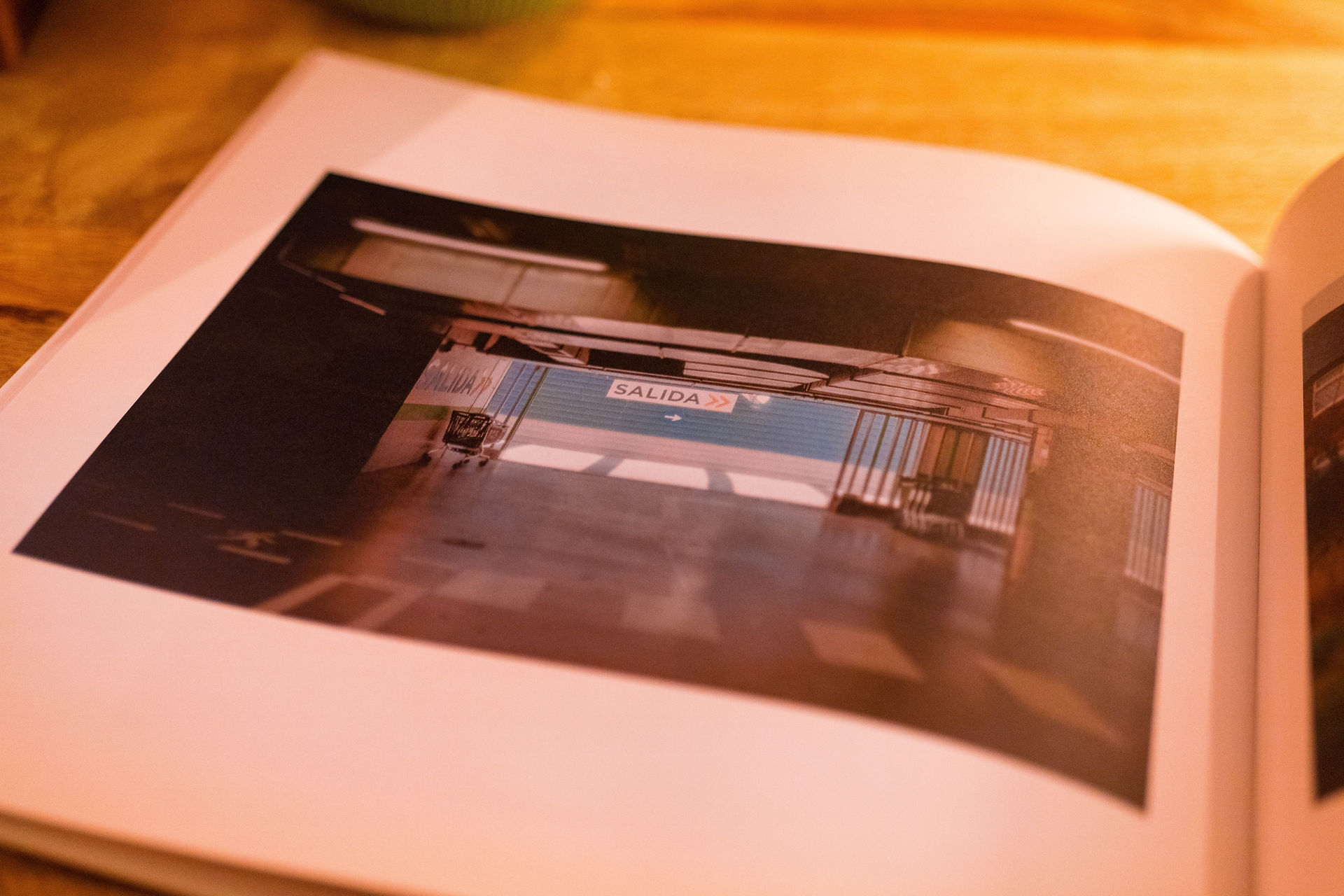 A page of a book showing a picture of an underground car park in Spain 