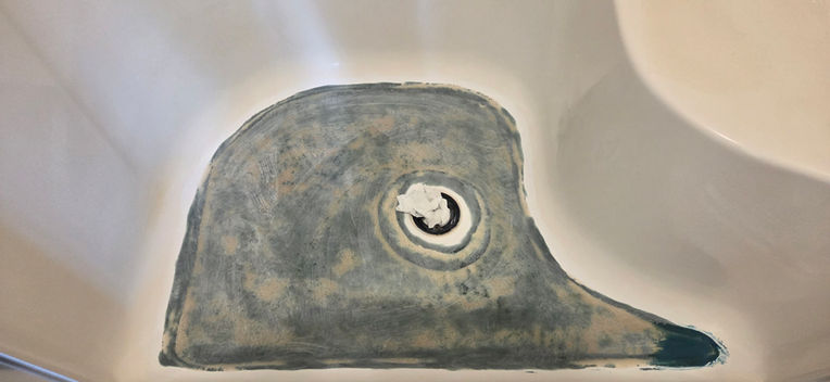 Applying filler to bathtub surface to repair cracks and create smooth finish by BathQuest