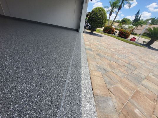 Apron Barracuda Garage Flooring with concrete brown tiled bricks on the right