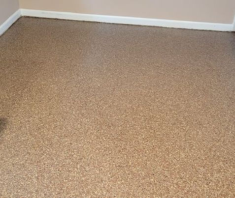 beaver dam polyaspartic epoxy flooring garage coatings while a worker is finishing the last coat