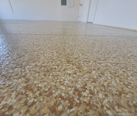 closeup of buttercream polyaspartic epoxy flooring