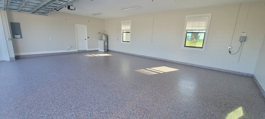 A detailed view of the Orange Chopper epoxy flake blend, showcasing bright orange hues that bring a lively and spirited atmosphere. The blend captures the excitement of adventure with a hint of tranquility, ideal for a bold and vibrant garage floor.