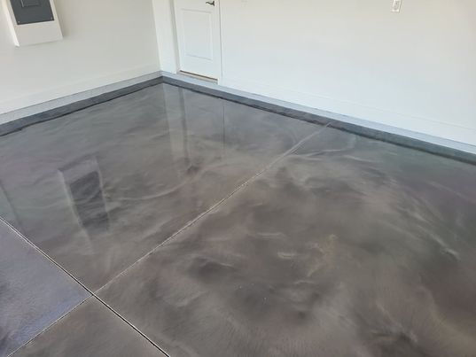 Metallic epoxy flooring customized with a blend of colors to match the homeowner's style and enhance visual appeal.