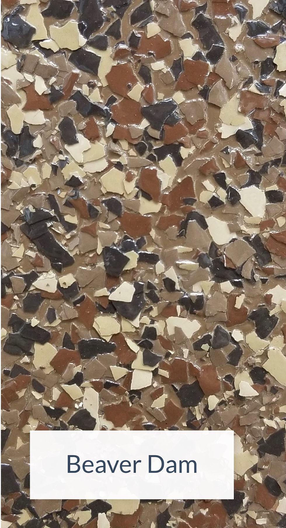 Close-up of Beaver Dam epoxy flooring blend, featuring earthy tones reminiscent of pine cones and fallen leaves.