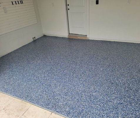 Orbit Flake Blend Garage Floor Upgrade: Upgrade your garage floor with our Orbit flake blend epoxy flooring, featuring a blend of bold tones that add sophistication and durability, perfect for high-traffic areas.