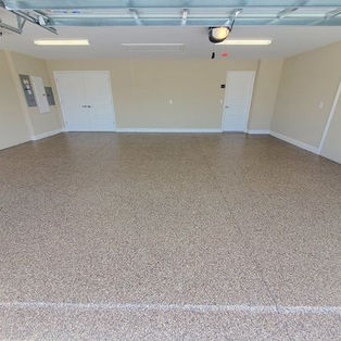 323 garage flooring with creme walls and white door in background