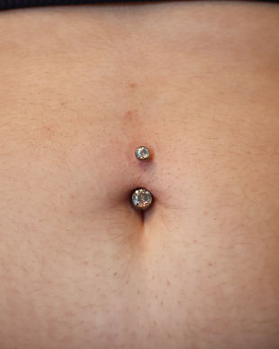A navel piercing fitted with a navel curve from Industrial Strength. Llangefni, Isle of Anglesey, North Wales.