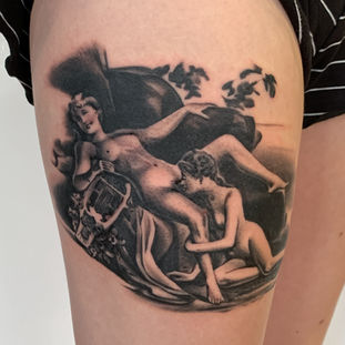 A black and grey tattoo of a classic painting depicting Sappho, on a leg. Made in Llangefni, Isle of Anglesey, North Wales by Shelley Williams. 