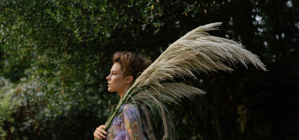 Model holding pampas, this is the image that represents frank Giacone spa salon