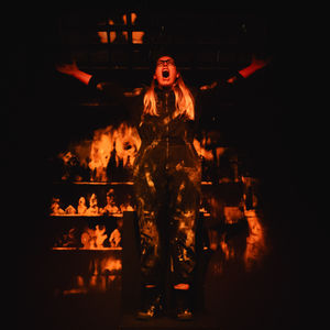 Gabriella Moran as Mother, Father, Jack in Lost Watches (2025), watching the house burn to the ground.