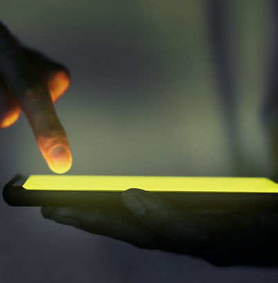 hand-touching-illuminated-smartphone-screen.jpg