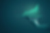 Deep green image of someone holding up a graph