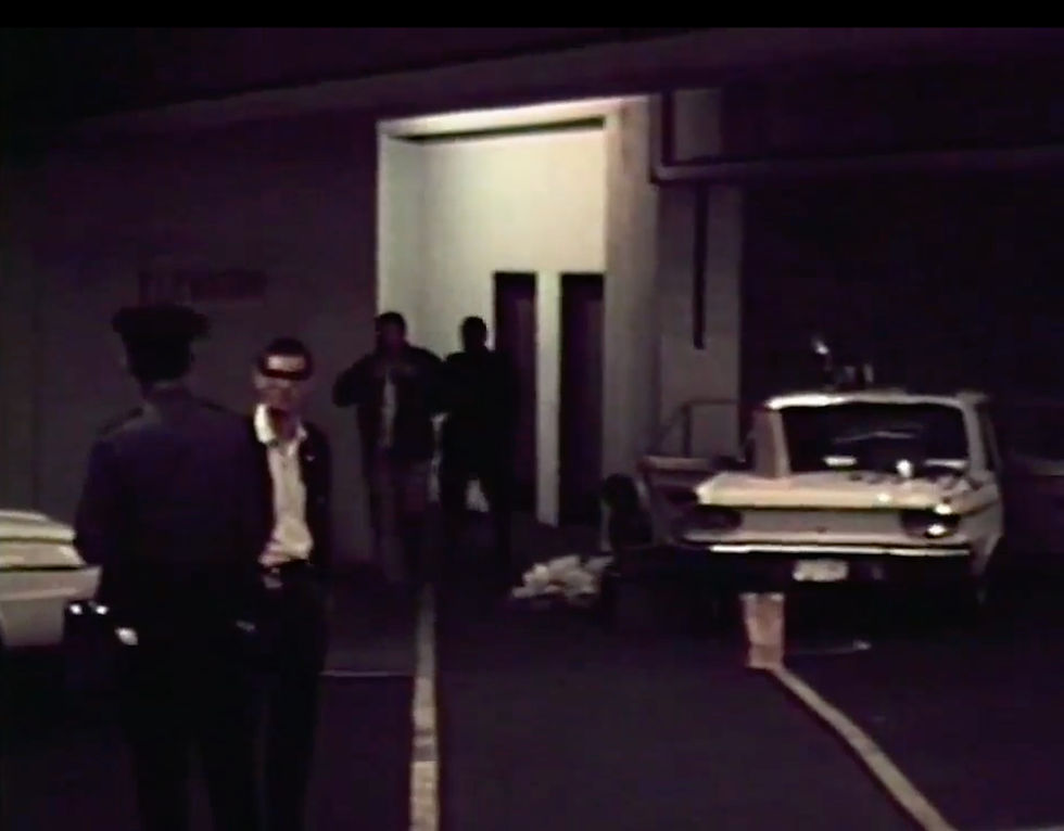 Detectives process the scene at the elevator inside the parking garage- KOMO