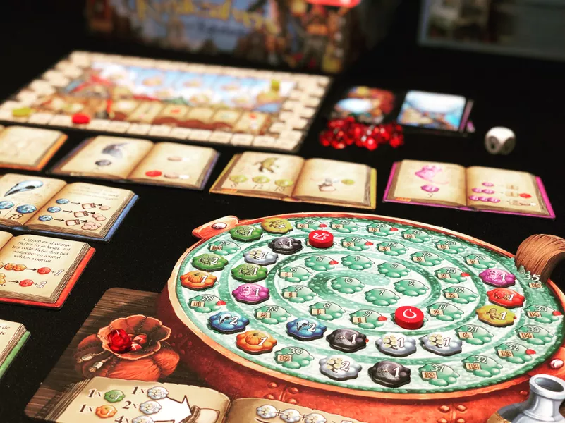 Why It’s Great: In Quacks, players brew potions by pulling ingredients from a bag, balancing risk and reward. Its push-your-luck mechanics and quirky theme make every round exciting. 



Who’ll Love It: Gamers who enjoy luck-driven thrills with a dash of strategy. 



Playtime: 45 minutes | Players: 2-4 | Complexity: Medium