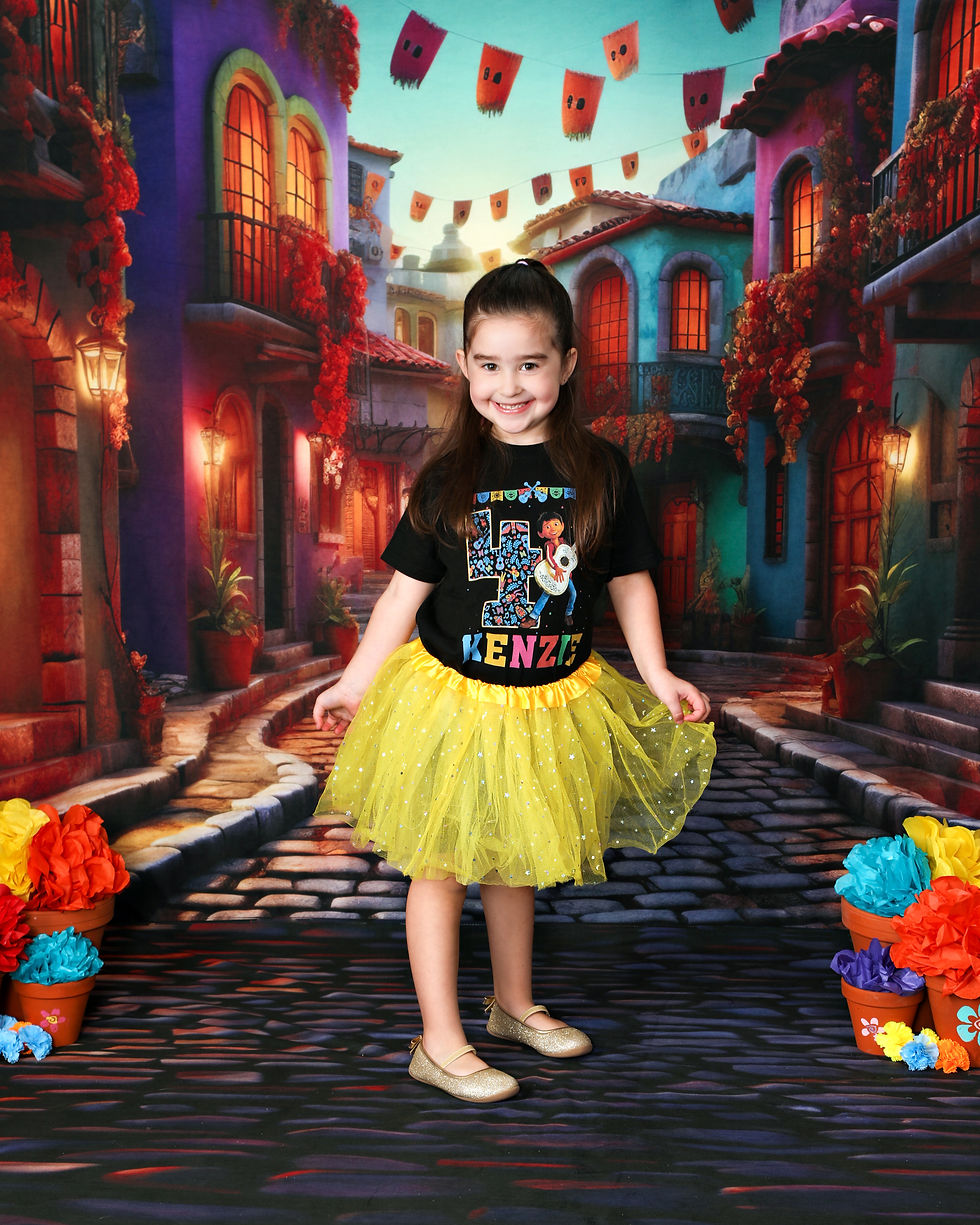 Girl in a yellow tutu with a big smile