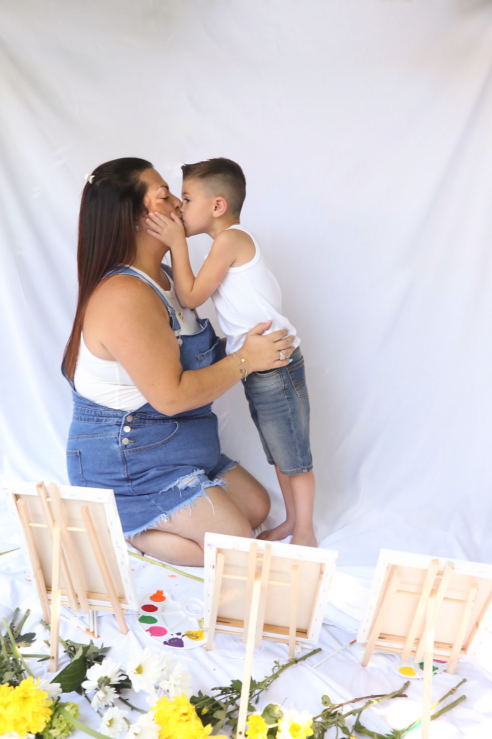 Boy giving his mom a kiss