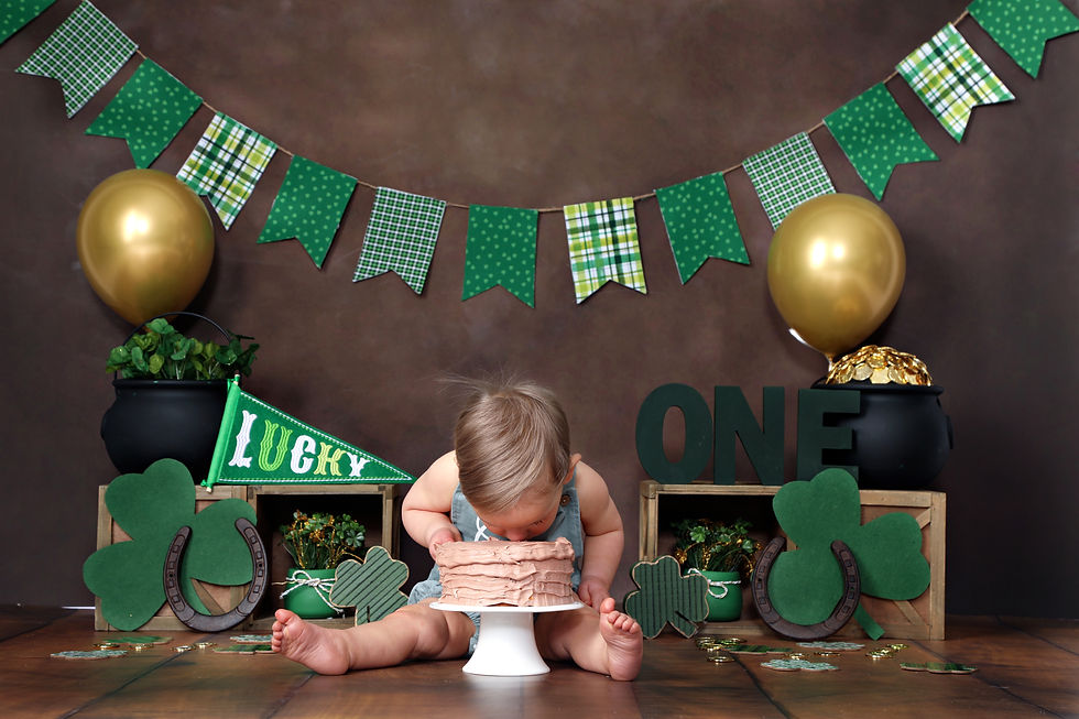 Little boy bending over and eating birthday cake