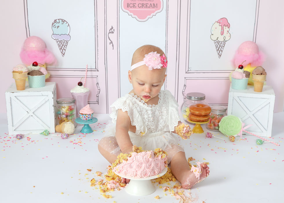 little girl with sweets and birthday cake