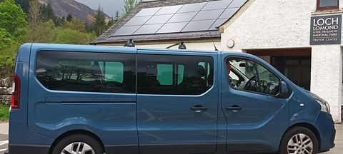 Our minivan for small group tours parked at Loch Lomond & The Trossachs National Park.
