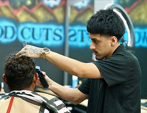 Expert barber delivering a precise shave with a straight razor for a sharp, clean look