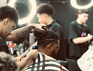 Hollywood-inspired fade haircut with precision detailing by expert barber