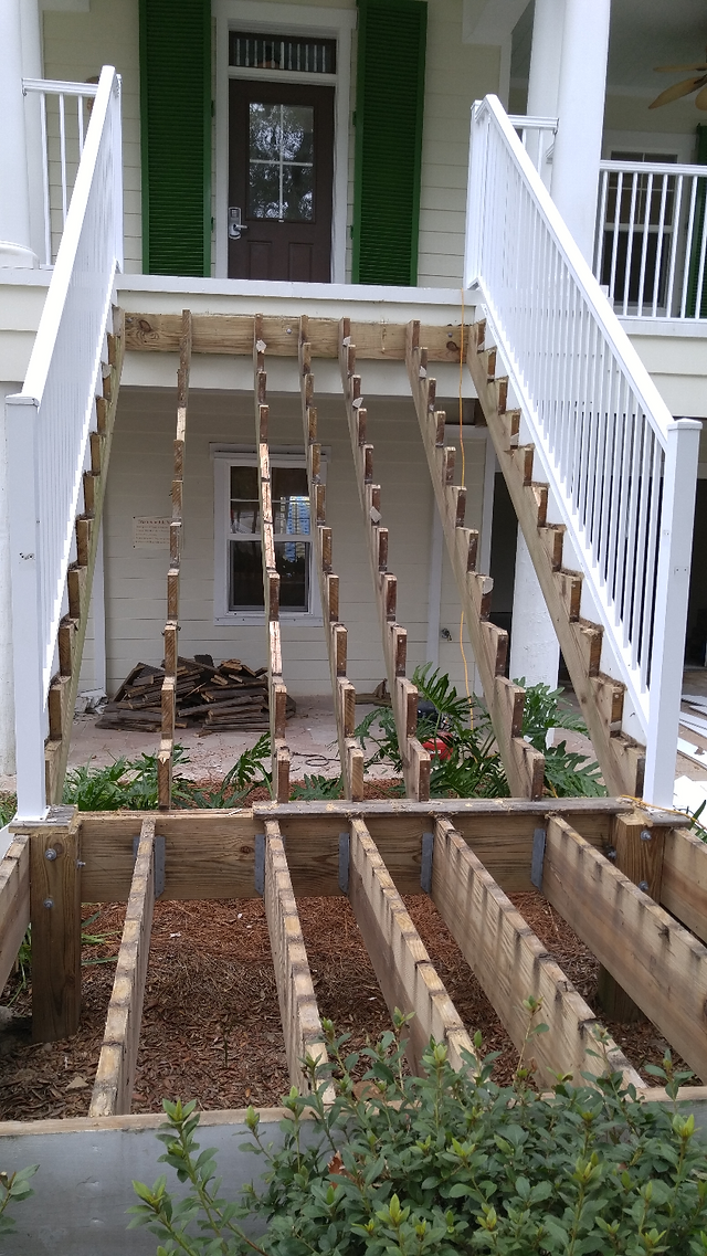 Old stair tread, risers and hand rails removed.