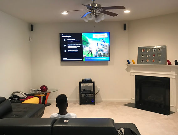 85" Flat screen mounted on wall with surround sound. Richmond, VA