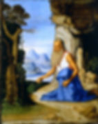 San Girolamo (Basaiti). El santo ora ante una gran cruz y guarda en la mano derecha una piedra con la que se golpea