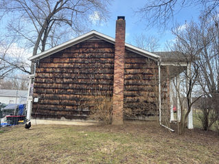 Cedar shake siding damaged after being cleaned with a pressure washer