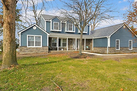 Front exterior of a Grosse Ile, Michigan home after siding, trim, and gutter replacement