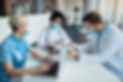 african-american-doctor-analyzing-medical-reports-with-her-colleagues-clinic.jpg