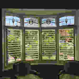Lead light windows with plantation shutters