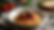 High angle view of a bowl of spaghetti topped with Italian baked meatballs and marinara