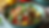 High angle view of a colorful bowl filled with lemon lentil chicken salad with feta