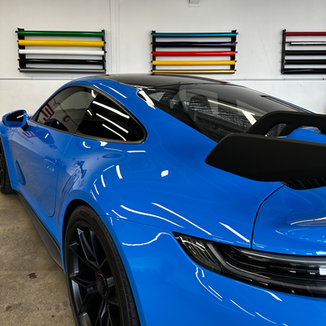 Blue wrap and carbon fibre vinyl wrapped Porsche at Tiger Tint & Wrap, Christchurch