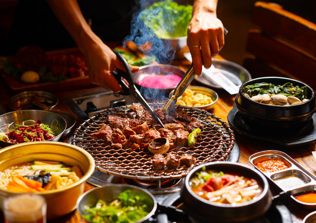 Grilling and cutting Korean BBQ meat