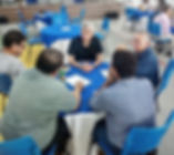 Developing leaders meeting around table