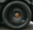 a close up of a black sports car tire_edited_edited.jpg