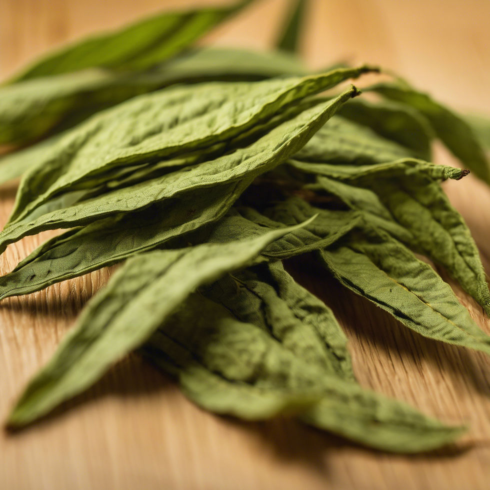 Loose dried green tea leaves spread on a wooden surface, showcasing their natural texture and vibrant color