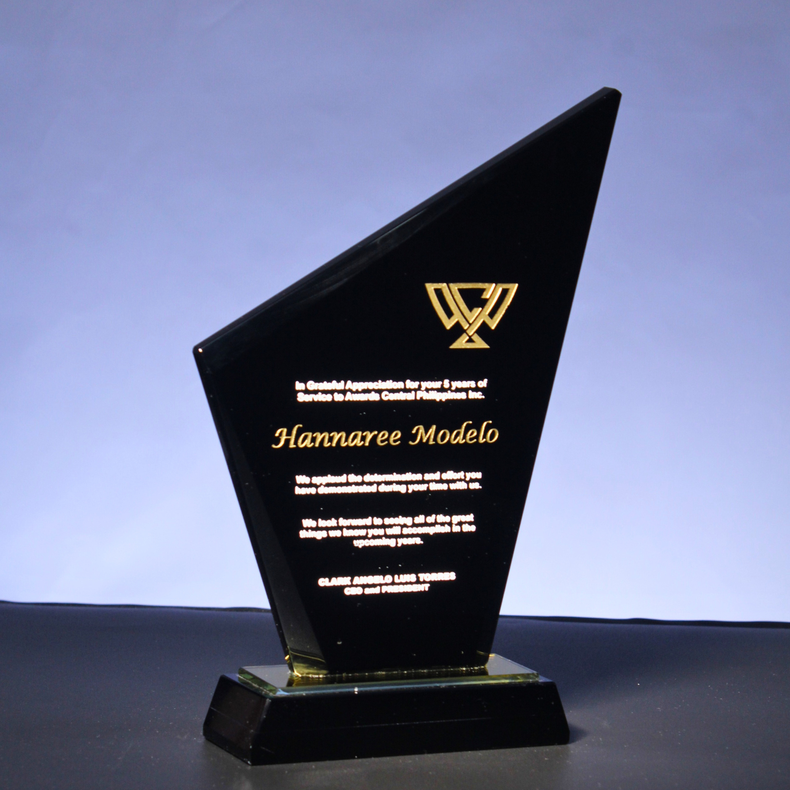 - This dynamic, angular obsidian glass plaque signifies ambition and forward-thinking with its sharp polygonal design. - Its