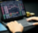 A computer screen displaying the Binance portal, a popular platform for investing in cryptocurrencies. The user, sitting comfortably in front of the computer, appears to be fully engaged in their investment activities.