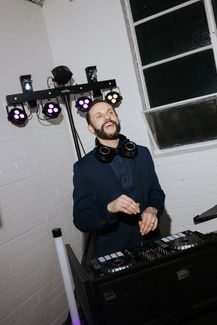 Wedding DJ behind the decks