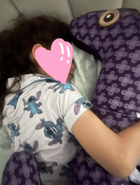 Avishag finally sleeping alone in her bed with comfort from “Ollie“